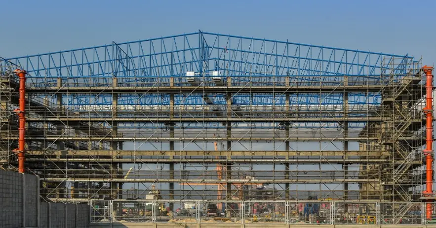 low-angle-view-construction-site-against-clear-blue-sky-X-5